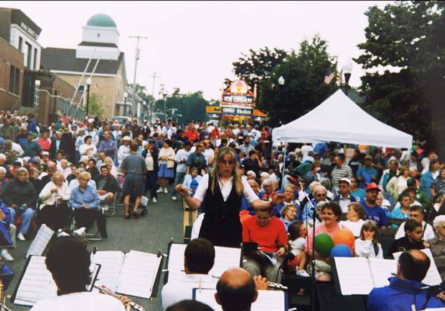 Danielle Allie conducting The Alumni Band at La Kermesse block party in 1998