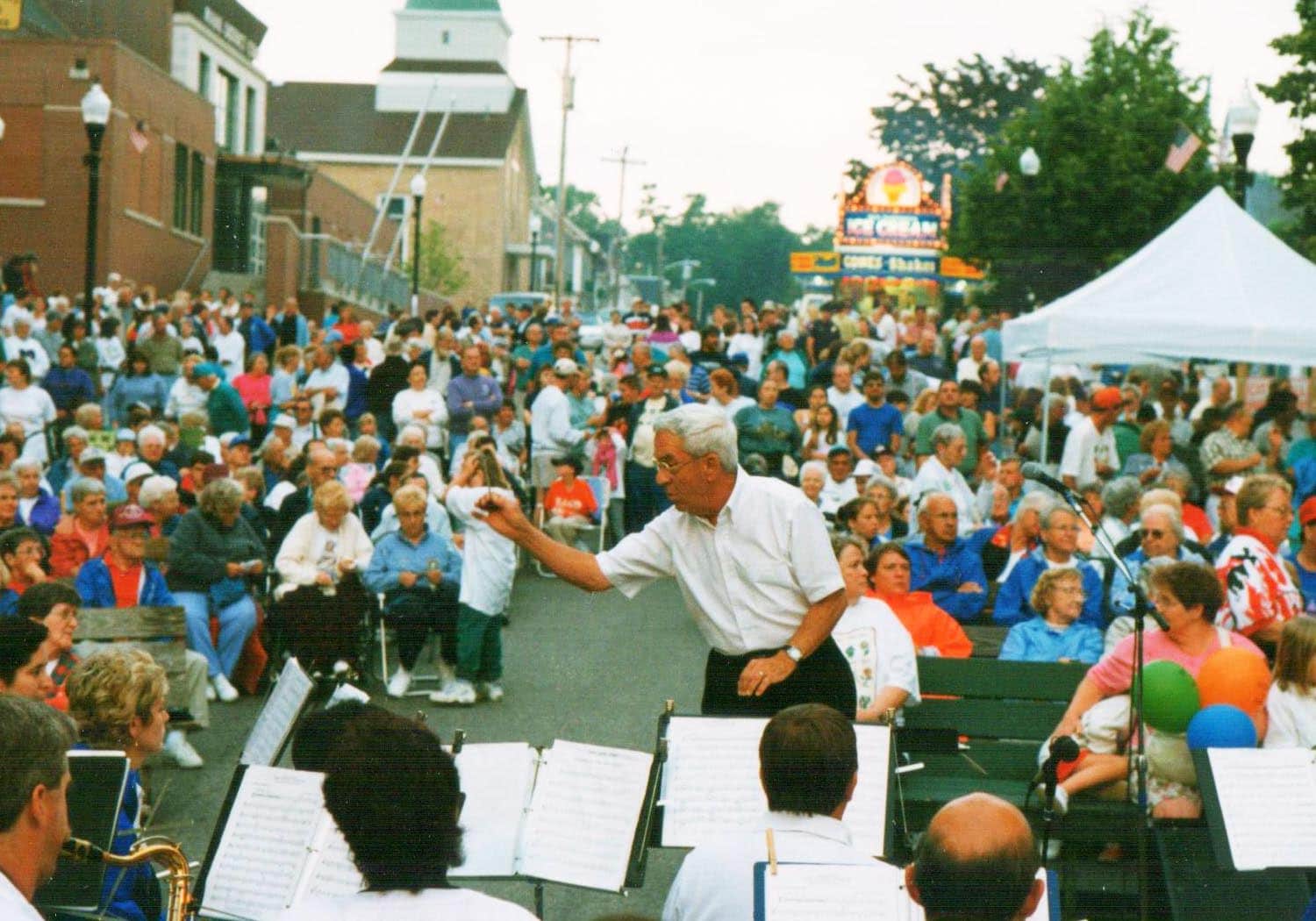 Marcel Mike Drapeau conducting The Alumni Band at La Kermesse in 1998