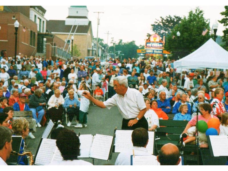 Mike Drapeau conducting at La Kermesse Block Party 1998