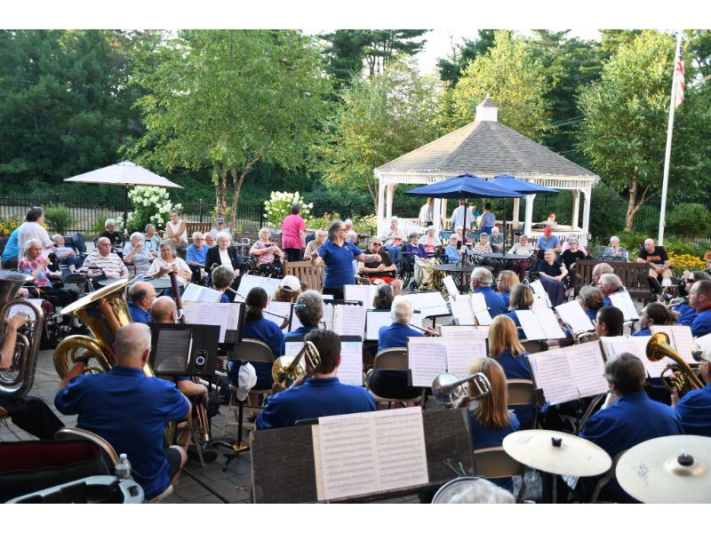 The Alumni Band performing at an outdoor garden concert for the community